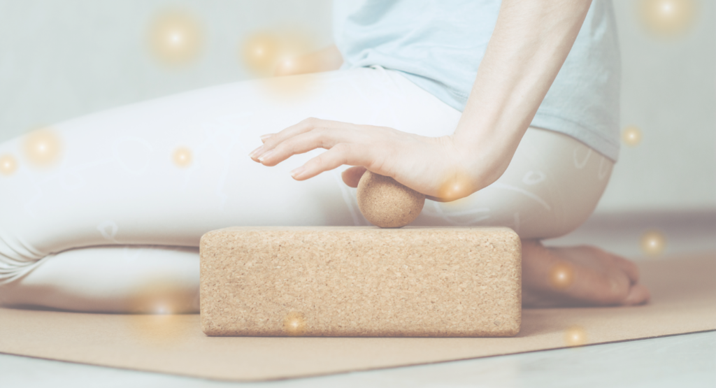 rolling hand with ball on yoga block