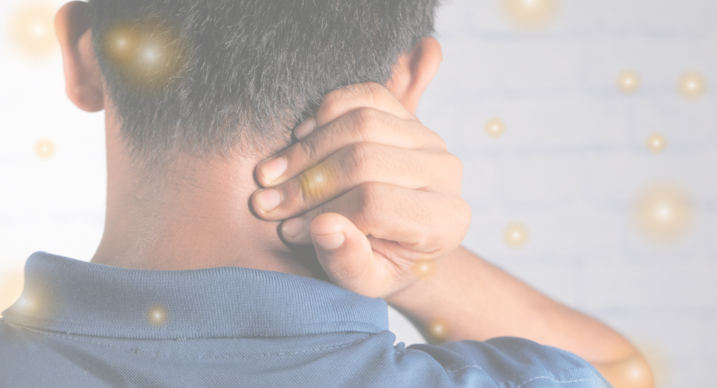 man in pain and massaging back of his neck