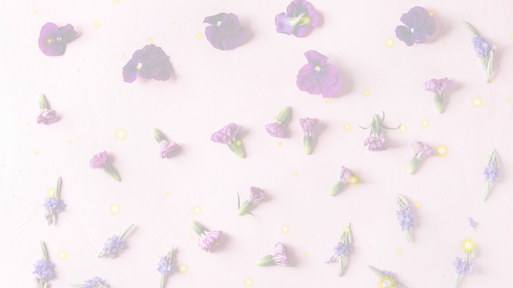 image of various purple foraged flowers laying haphazardly on pink background